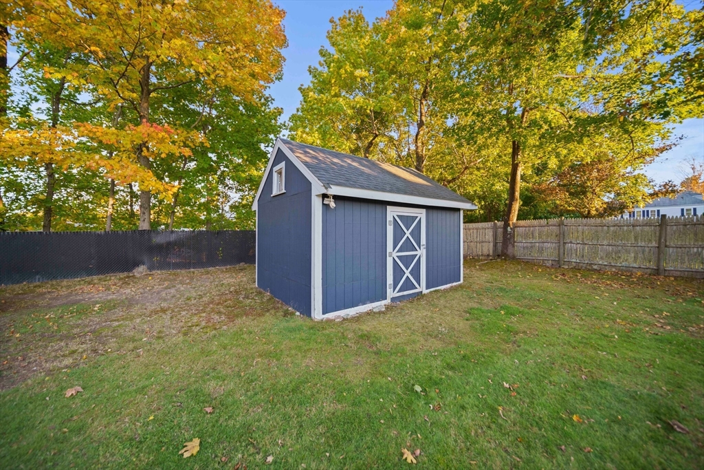 91 Prospect Street Canton, MA 02021 - Photo 33 of 41 a backyard of a house with lots of green space