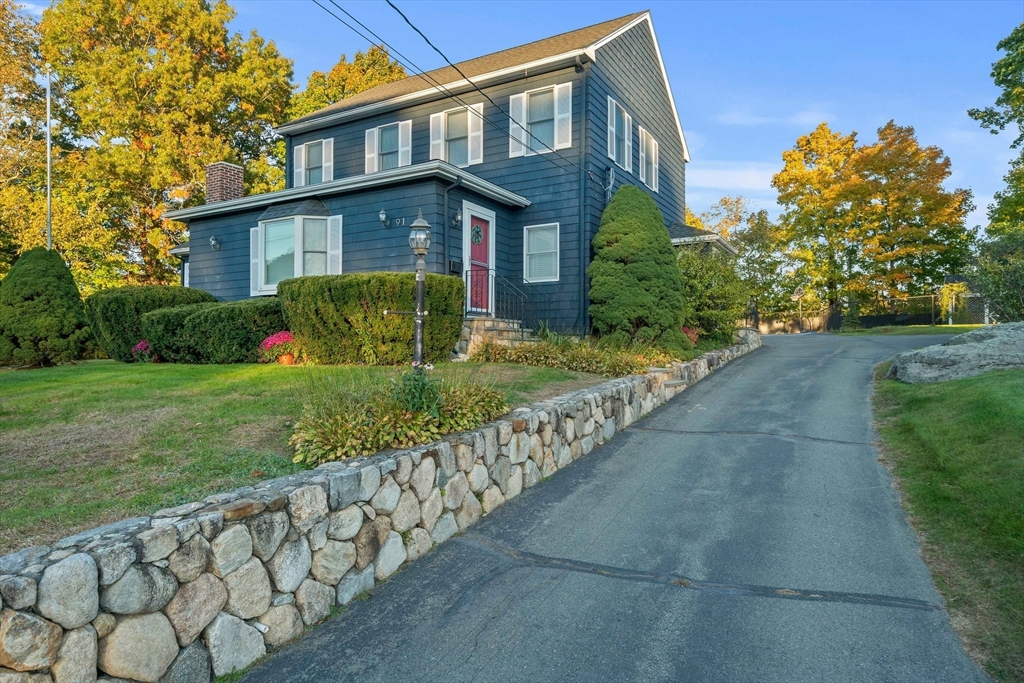 91 Prospect Street Canton, MA 02021 - Photo 36 of 41 a front view of a house with garden