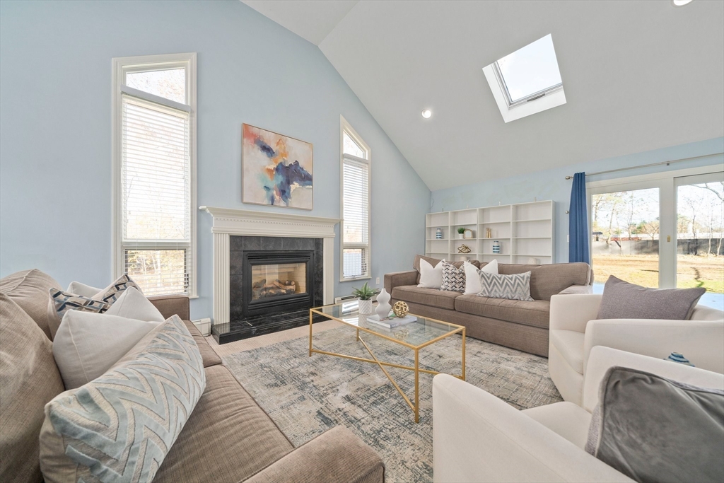 91 Prospect Street Canton, MA 02021 - Photo 4 of 41 a living room with furniture large window and a fireplace