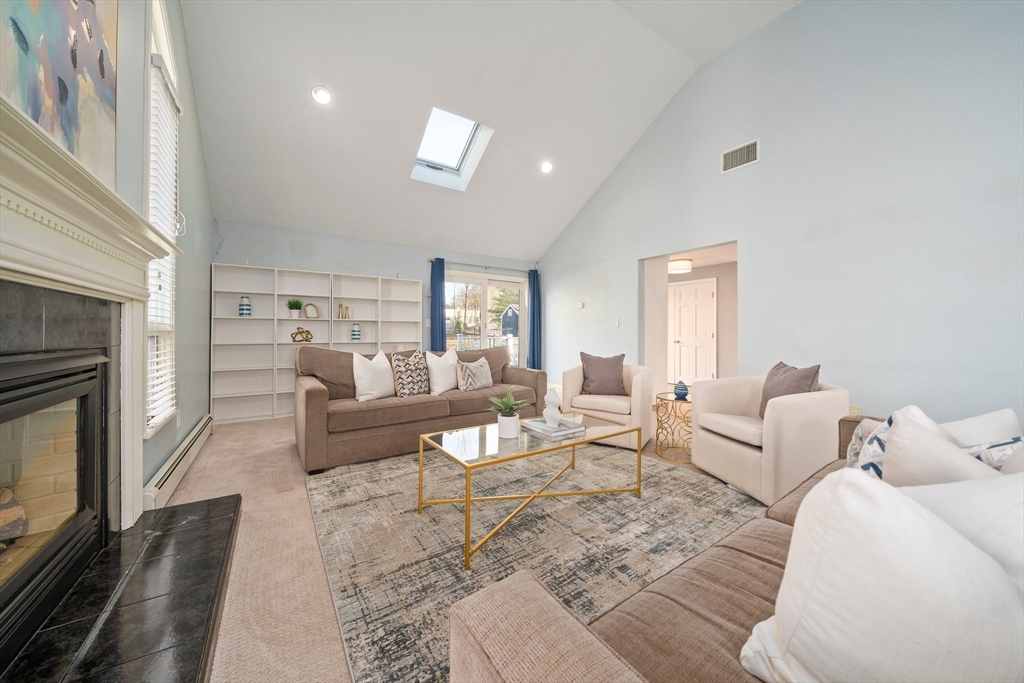 91 Prospect Street Canton, MA 02021 - Photo 6 of 41 a living room with furniture and a fireplace