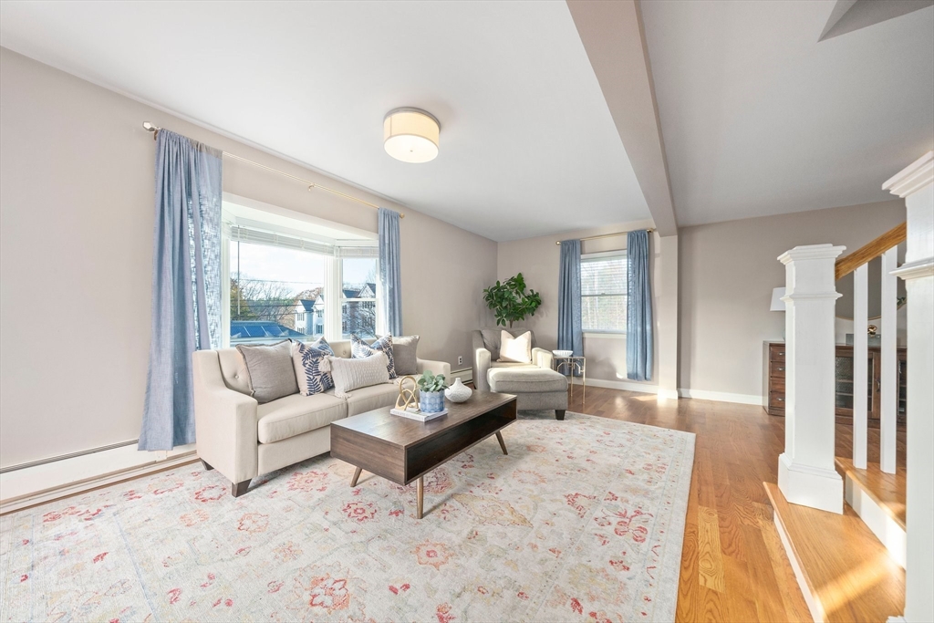91 Prospect Street Canton, MA 02021 - Photo 8 of 41 a living room with furniture and a large window