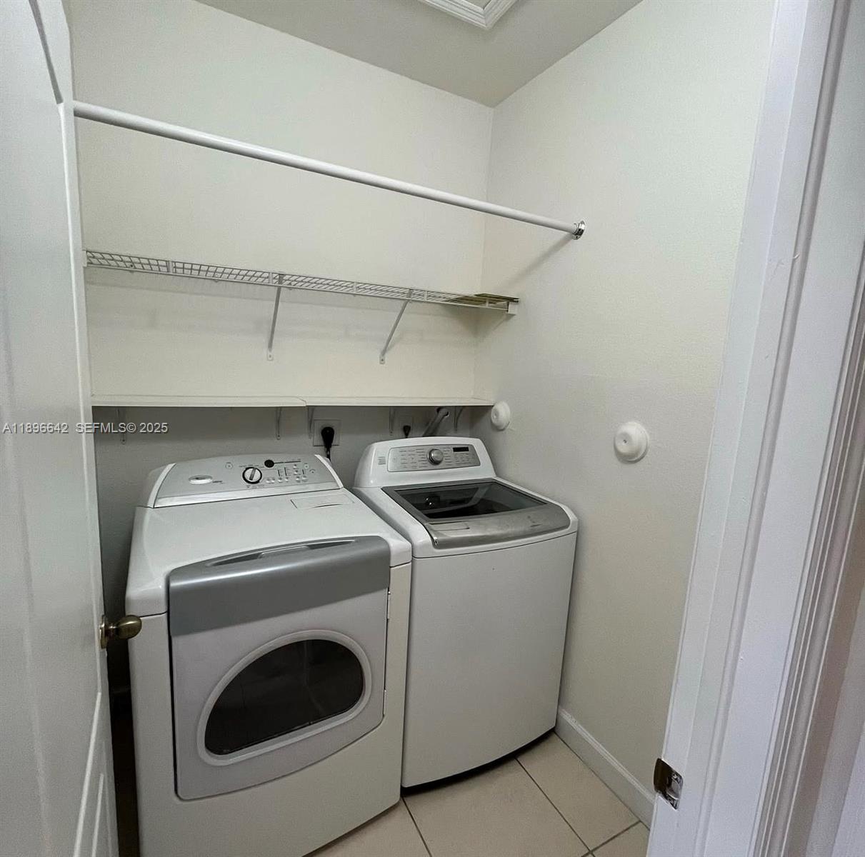 14905 Southwest 8th Terrace Miami, FL 33194 - Photo 6 of 9 a utility room with dryer and washer
