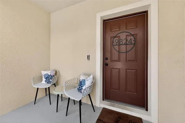 a white toilet sitting next to a white walls