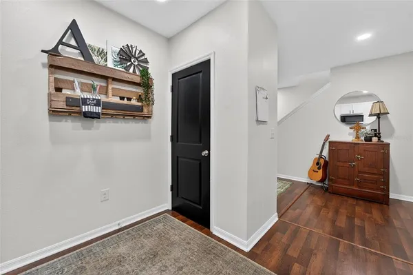 a bedroom with a bed and cupboard
