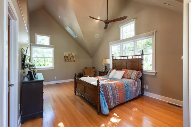 a view of a brick house with a tree
