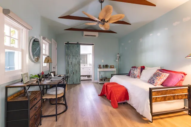 a kitchen with a table and chairs