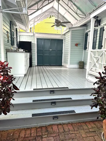 a bedroom with a bed and a flat tv screen on dresser