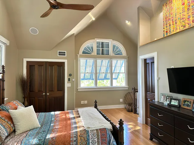 a bathroom with a granite countertop sink a toilet and mirror