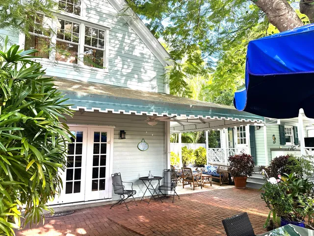 a kitchen with stainless steel appliances kitchen island granite countertop a stove a sink and a microwave