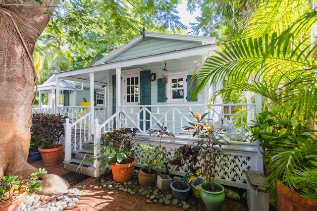 a view of an outdoor sitting area with brick walls