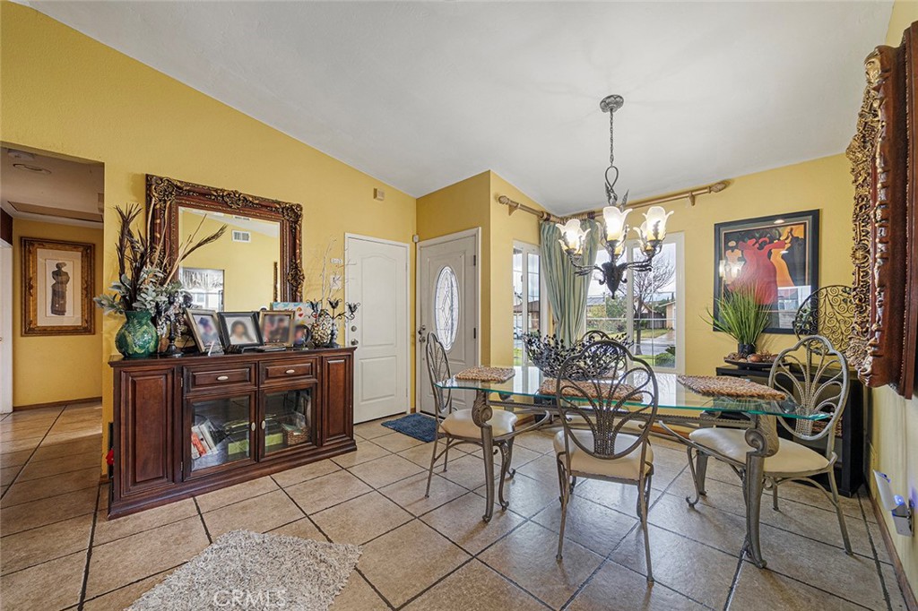 15465 Raymond Avenue Fontana, CA 92336 - Photo 11 of 27 a view of a dining room with furniture window and outside view