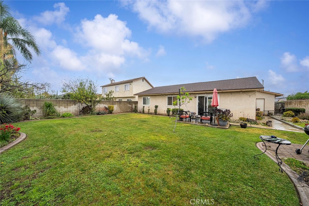 15465 Raymond Avenue Fontana, CA 92336 - Photo 23 of 27 a aerial view of a house with swimming pool garden and porch