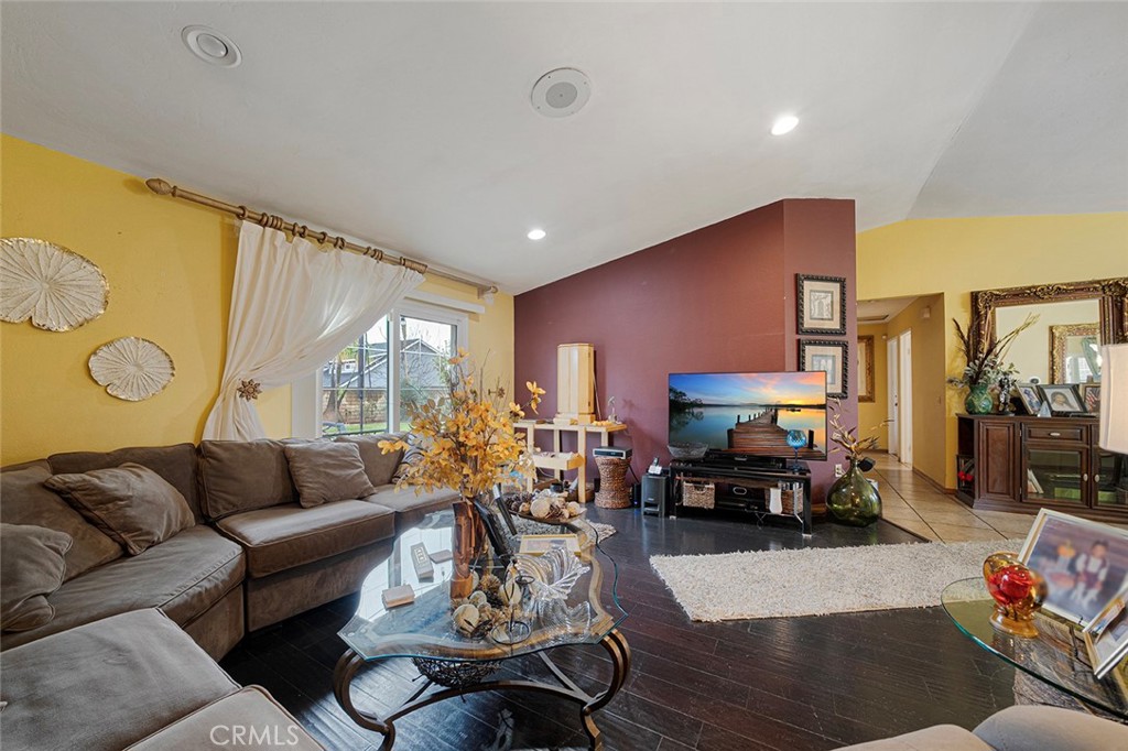 15465 Raymond Avenue Fontana, CA 92336 - Photo 10 of 27 a living room with furniture kitchen view and a large window