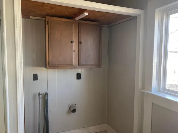 a bathroom with a shower and a window