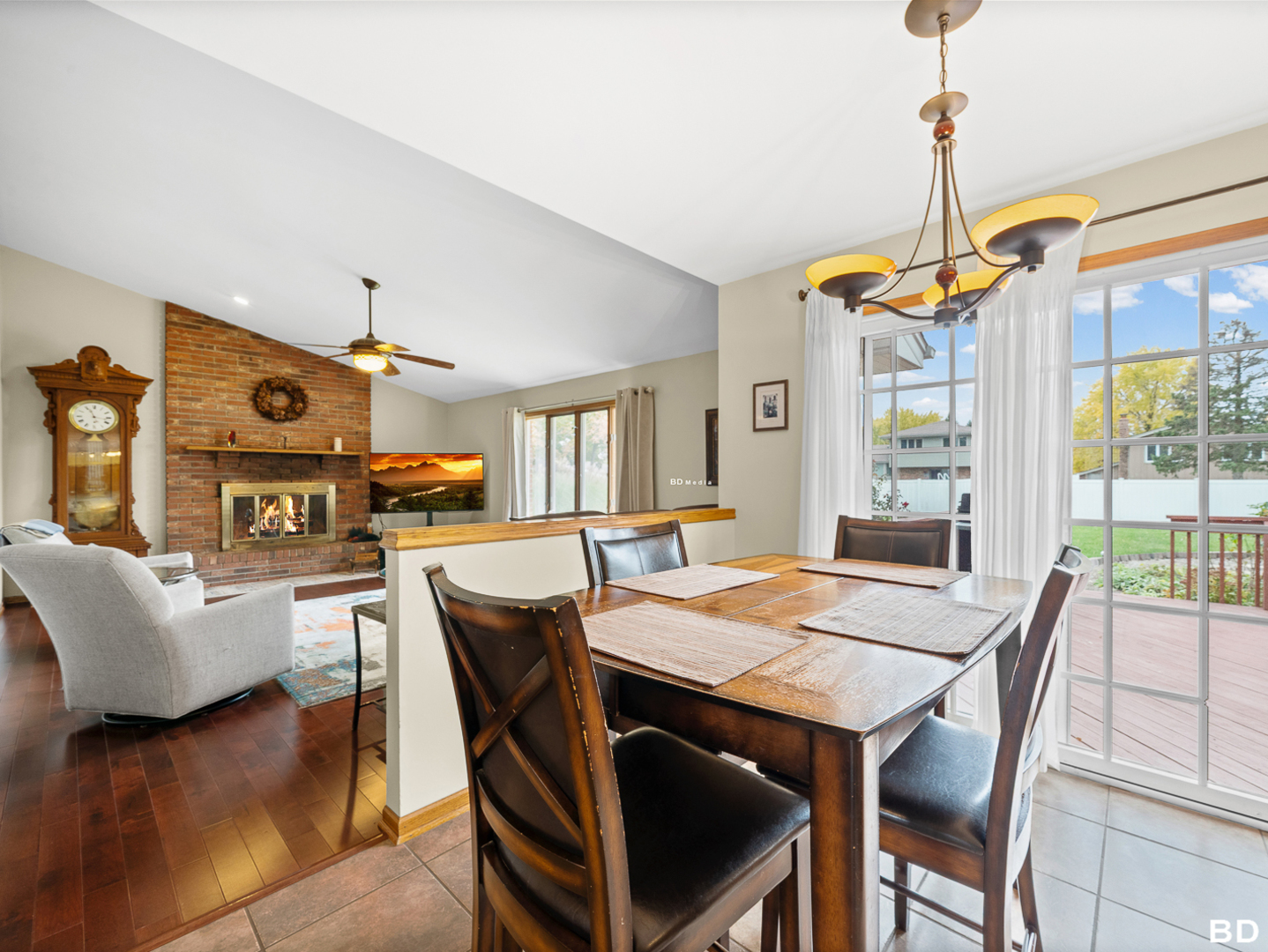 1525 Cimarron Drive New Lenox, IL 60451 - Photo 17 of 41 a dining room with furniture a chandelier and wooden floor