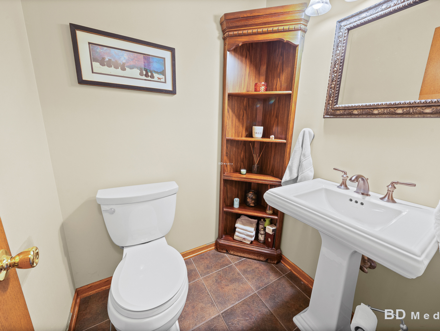 1525 Cimarron Drive New Lenox, IL 60451 - Photo 20 of 41 a white toilet sitting next to a bathroom sink