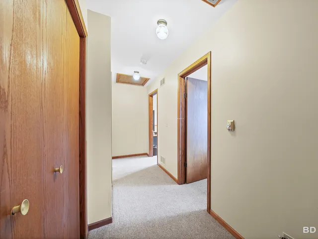 a view of a hallway with closet area