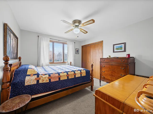 a bed room with a bed and a chandelier