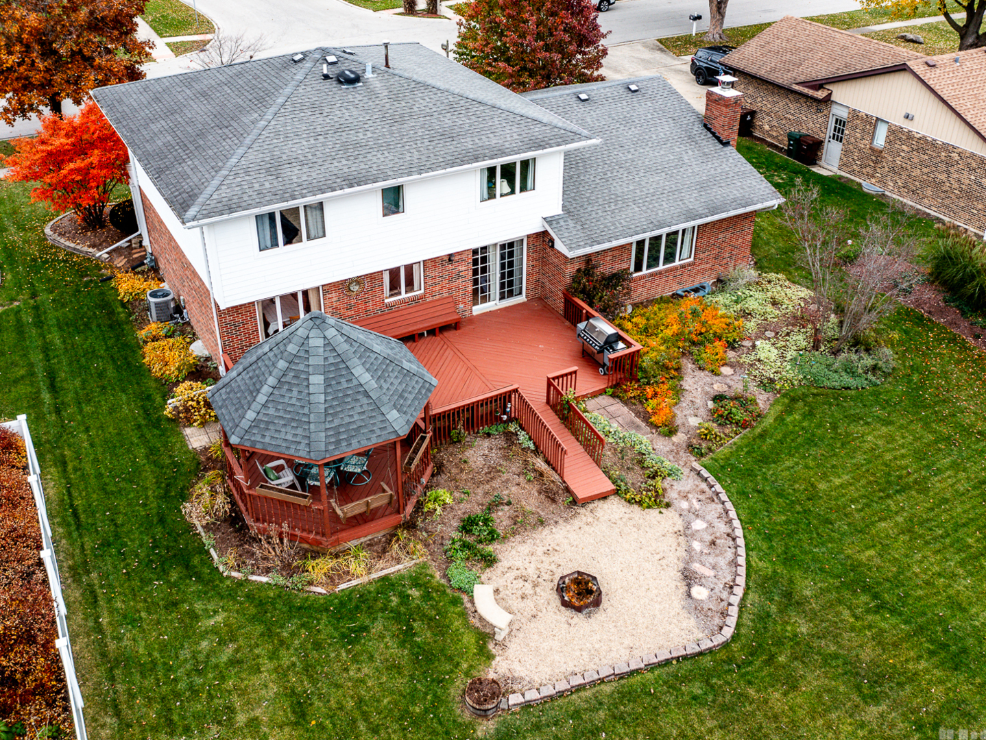 1525 Cimarron Drive New Lenox, IL 60451 - Photo 4 of 41 an aerial view of a house roof deck with chairs and a table