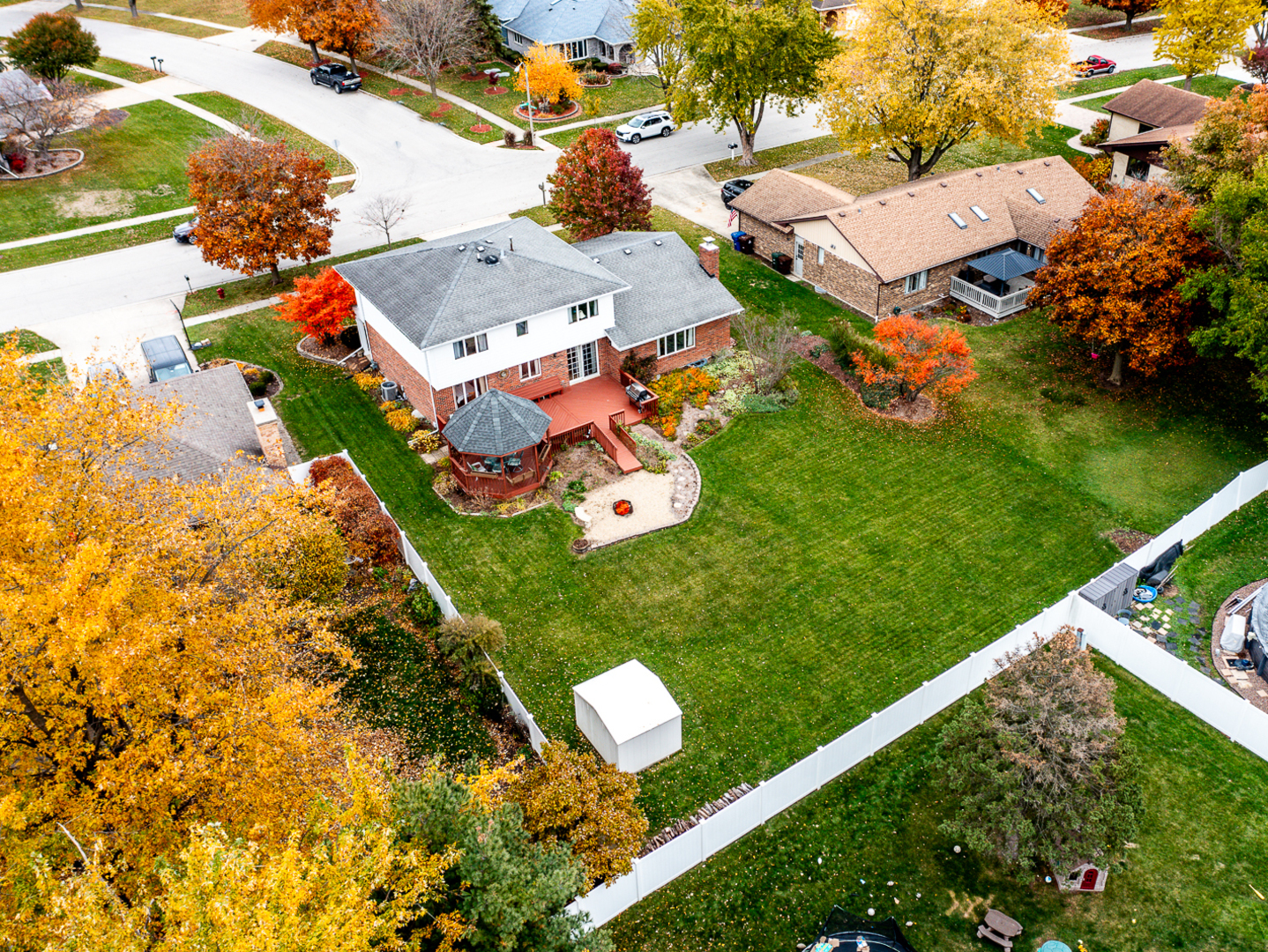 1525 Cimarron Drive New Lenox, IL 60451 - Photo 5 of 41 an aerial view of a house with a garden and trees