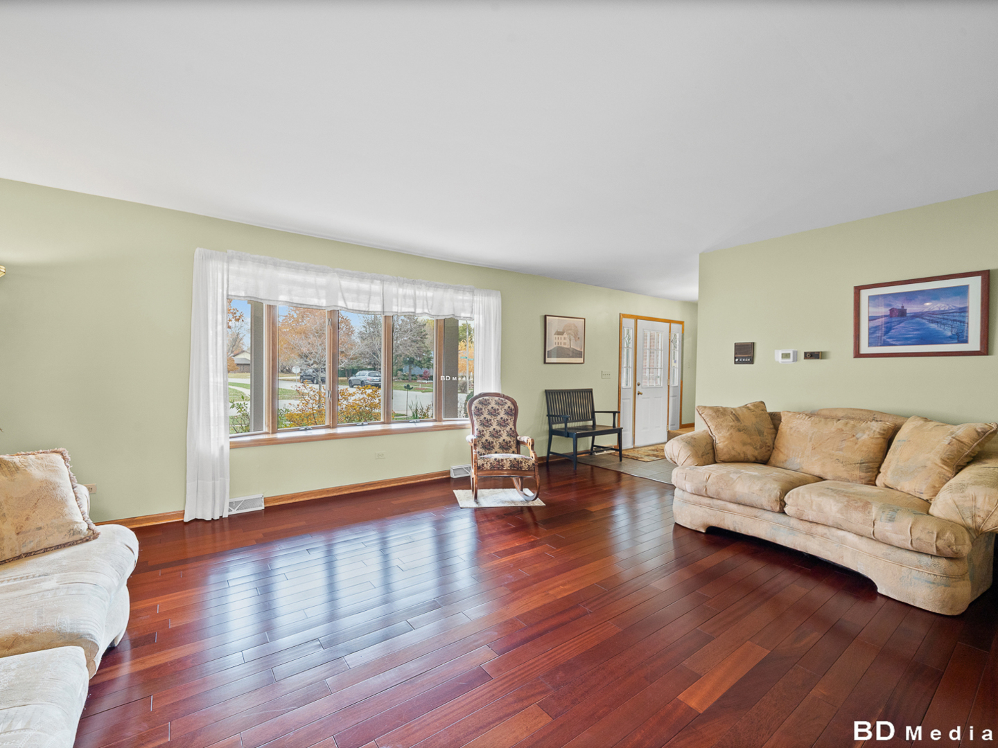 1525 Cimarron Drive New Lenox, IL 60451 - Photo 10 of 41 a living room with furniture and a large window