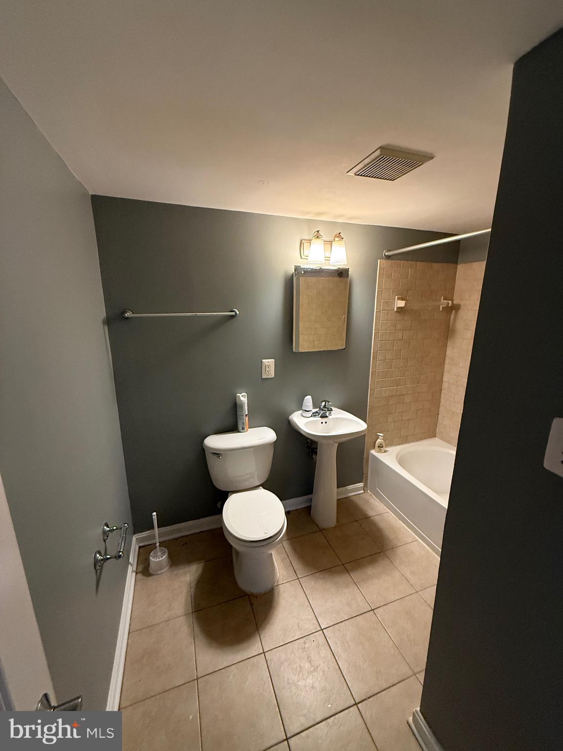 3103 Naylor Road Southeast, Unit B Washington, DC 20020 - Photo 12 of 16 a toilet sitting in a bathroom next to a sink