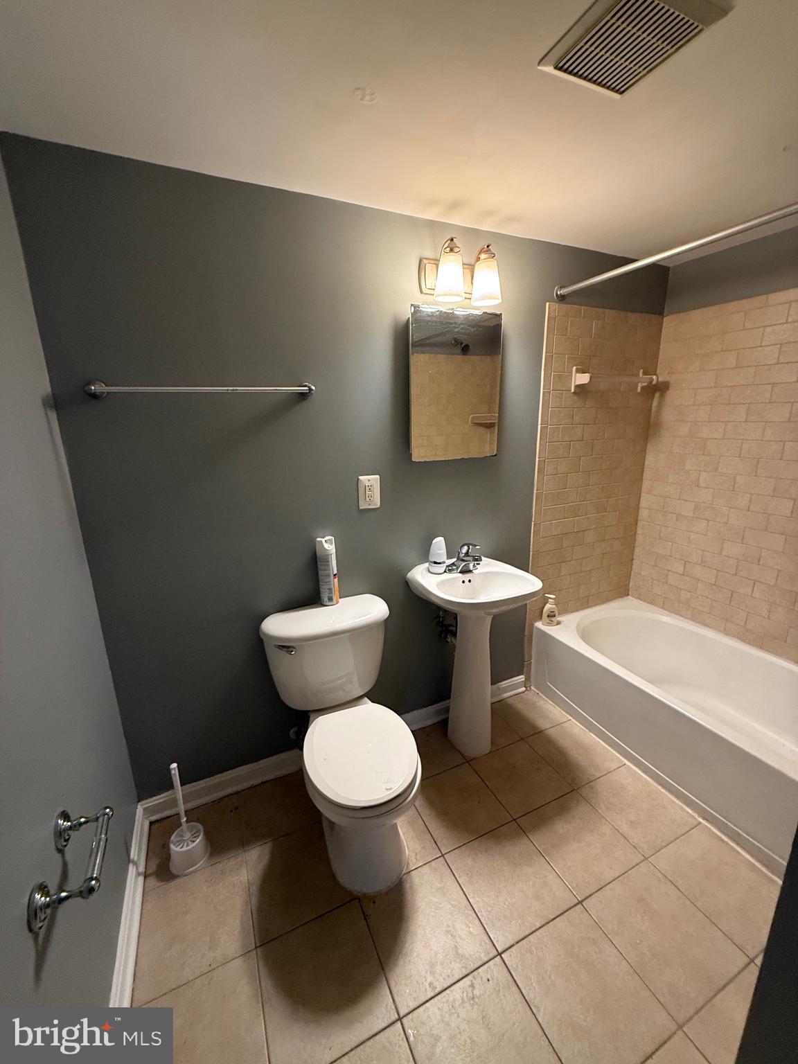 3103 Naylor Road Southeast, Unit B Washington, DC 20020 - Photo 16 of 16 a bathroom with a toilet sink and shower