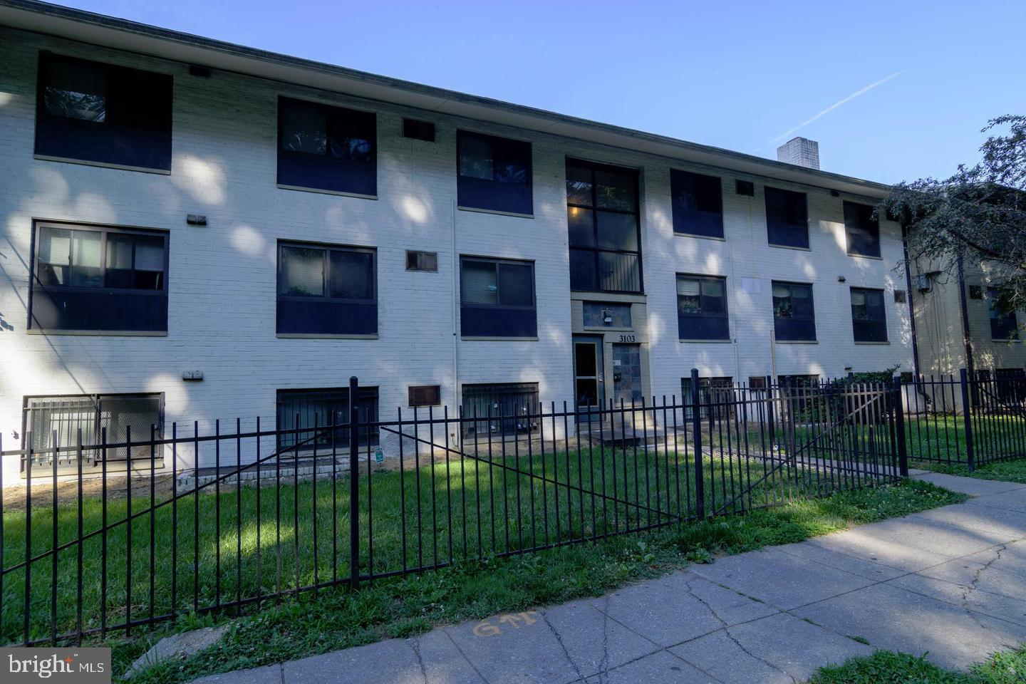 3103 Naylor Road Southeast, Unit B Washington, DC 20020 - Photo 2 of 16 a front view of a house with a garden