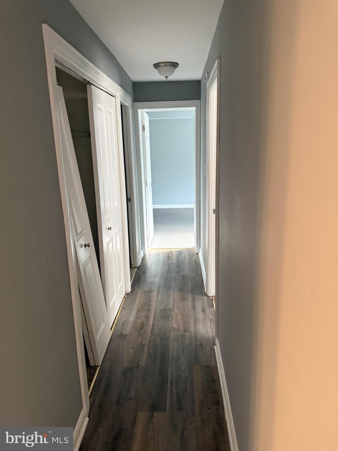 3103 Naylor Road Southeast, Unit B Washington, DC 20020 - Photo 7 of 16 a view of a hallway with wooden floor and staircase