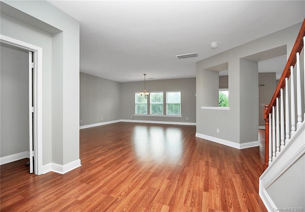 9522 Seamill Road Charlotte, NC 28278 - Photo 2 of 43 wooden floor in an empty room with a window