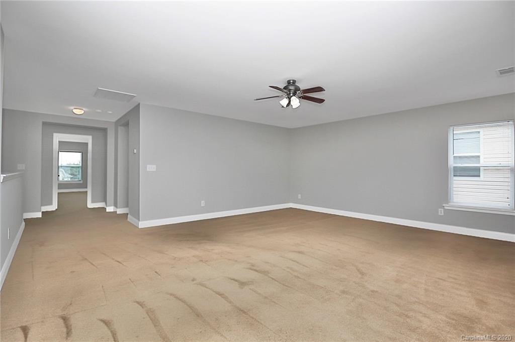 9522 Seamill Road Charlotte, NC 28278 - Photo 25 of 43 a view of an empty room with a window