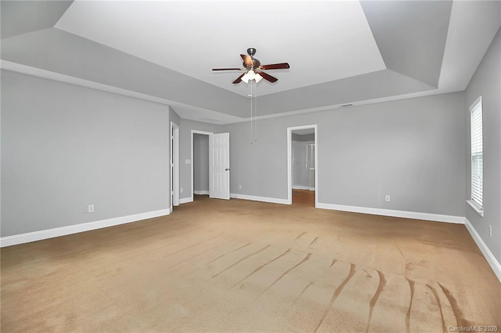 9522 Seamill Road Charlotte, NC 28278 - Photo 29 of 43 a view of a livingroom with a ceiling fan and window