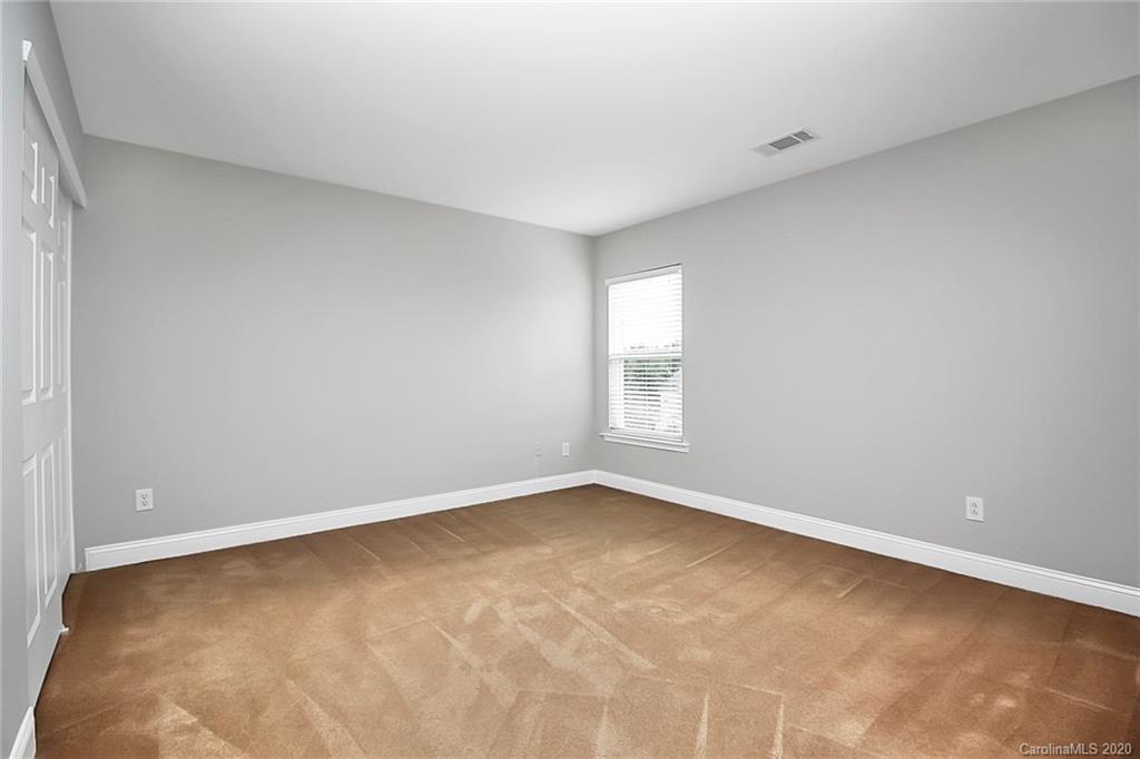 9522 Seamill Road Charlotte, NC 28278 - Photo 36 of 43 a view of an empty room with a window