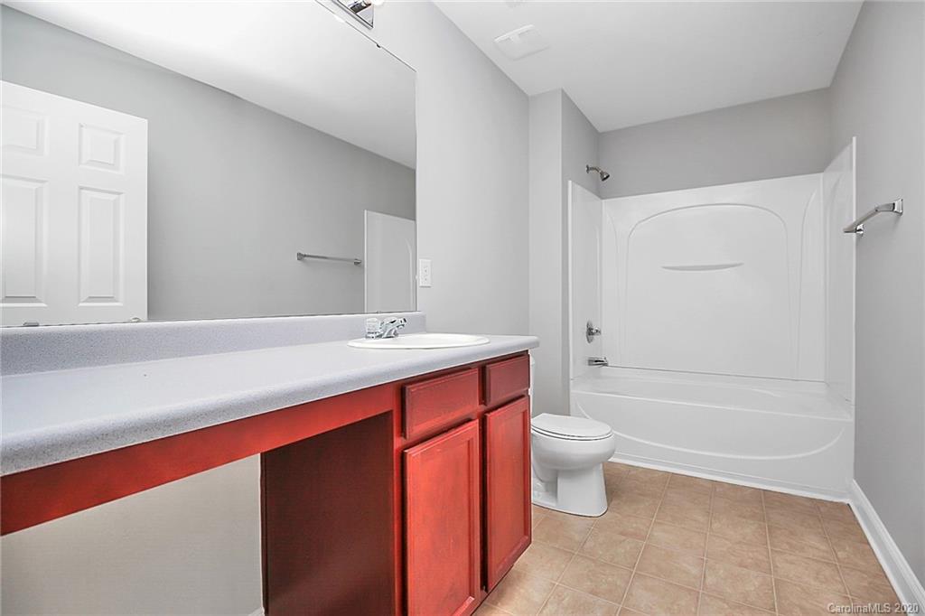 9522 Seamill Road Charlotte, NC 28278 - Photo 38 of 43 a bathroom with a sink a toilet and shower