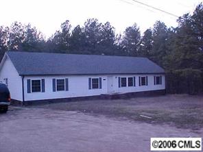 1343 Cline School Road Concord, NC 28025 - Photo 1 of 8 a house that has a tree in front of it