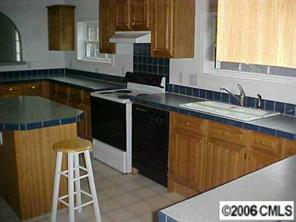 1343 Cline School Road Concord, NC 28025 - Photo 4 of 8 a kitchen with a sink and cabinets