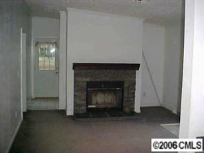 1343 Cline School Road Concord, NC 28025 - Photo 6 of 8 a living room with a fireplace