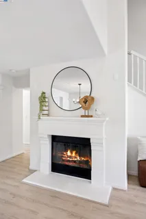 a room with a fireplace and a fireplace