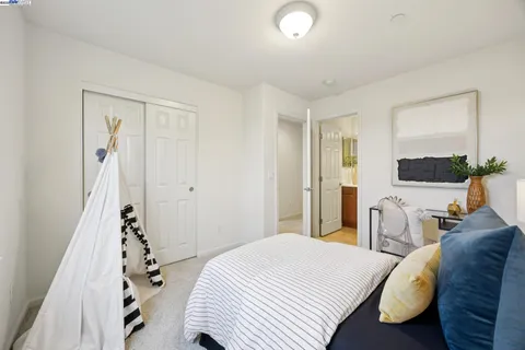 a bedroom with two beds and a window