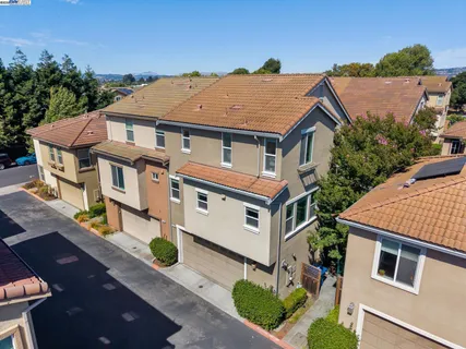 an aerial view of a house with a yard