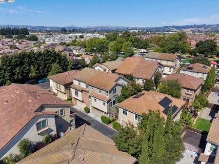 an aerial view of residential houses with outdoor space