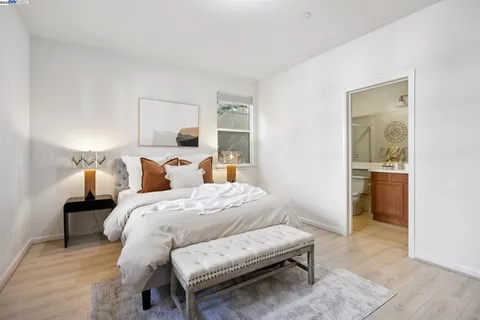 a bedroom with a bed and a couch