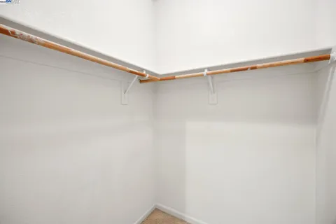 a view of a room with shelf on the wall