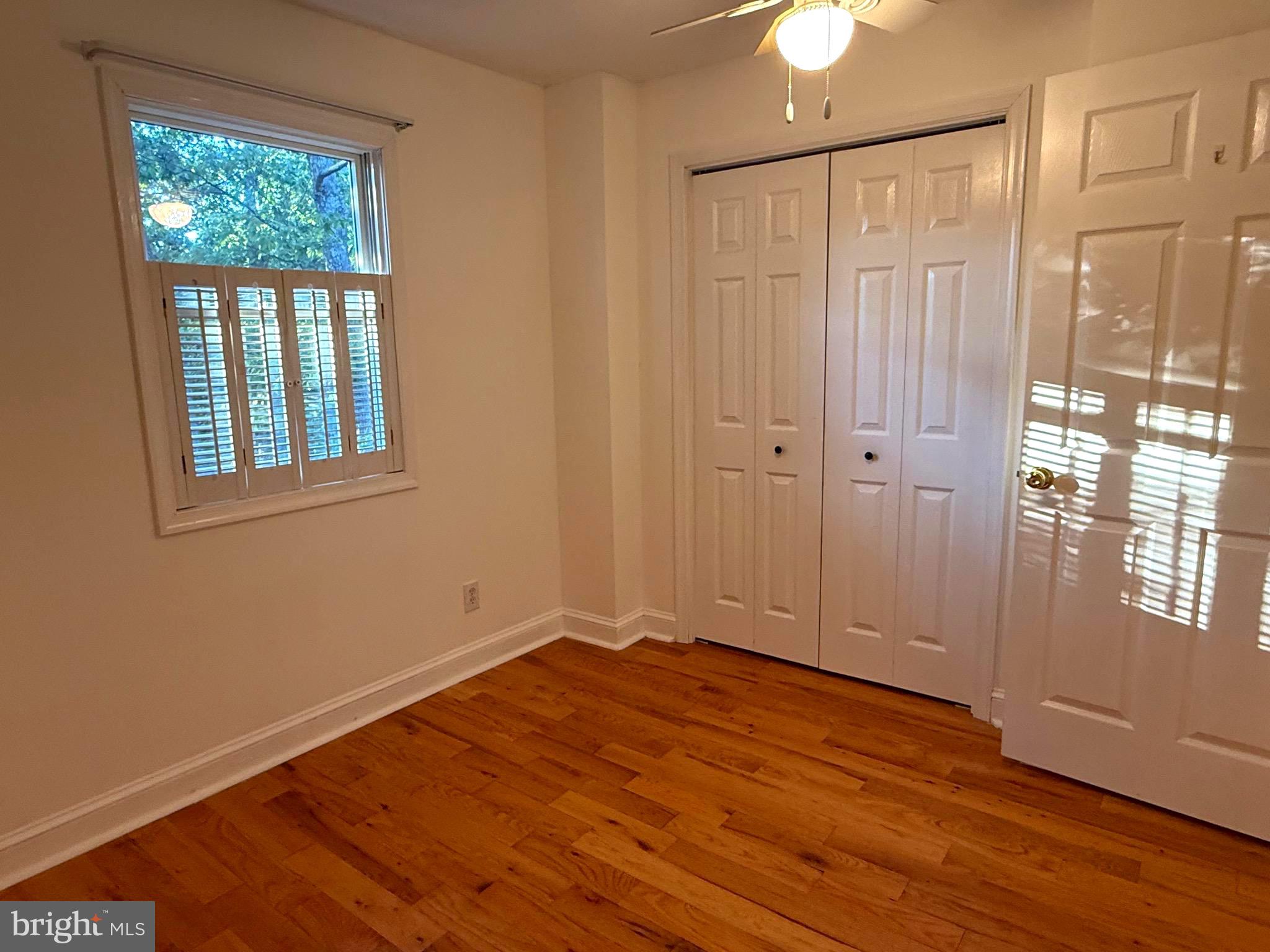 348 Trapper Ridge Lane Hedgesville, WV 25427 - Photo 11 of 41 wooden floor in an empty room with a window