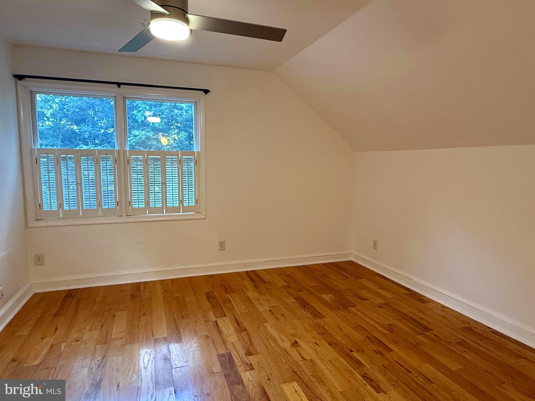 348 Trapper Ridge Lane Hedgesville, WV 25427 - Photo 13 of 41 a view of empty room with wooden floor and fan