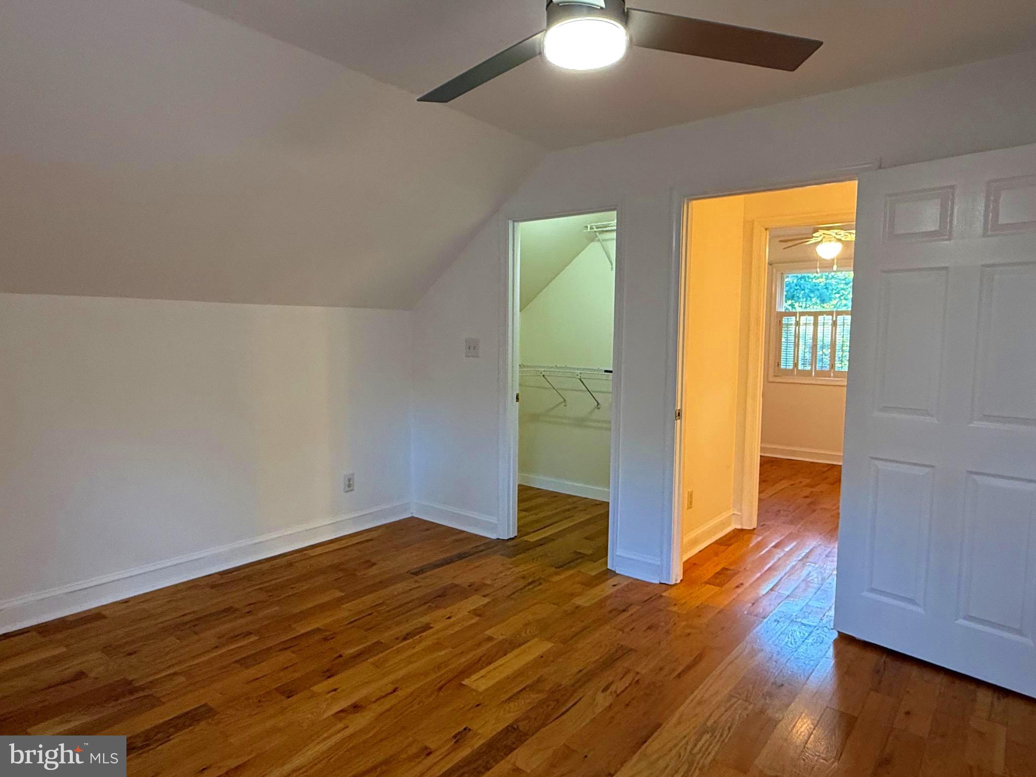 348 Trapper Ridge Lane Hedgesville, WV 25427 - Photo 14 of 41 a view of empty room with wooden floor and fan