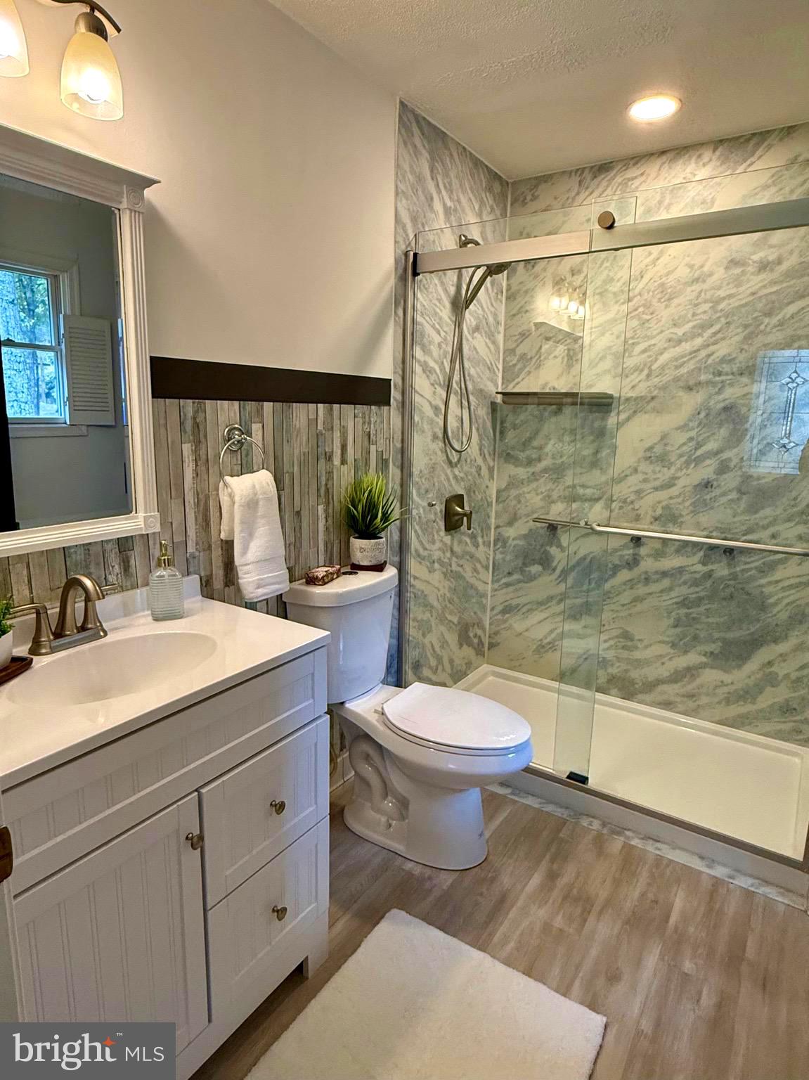 348 Trapper Ridge Lane Hedgesville, WV 25427 - Photo 15 of 41 a bathroom with a sink a toilet and shower