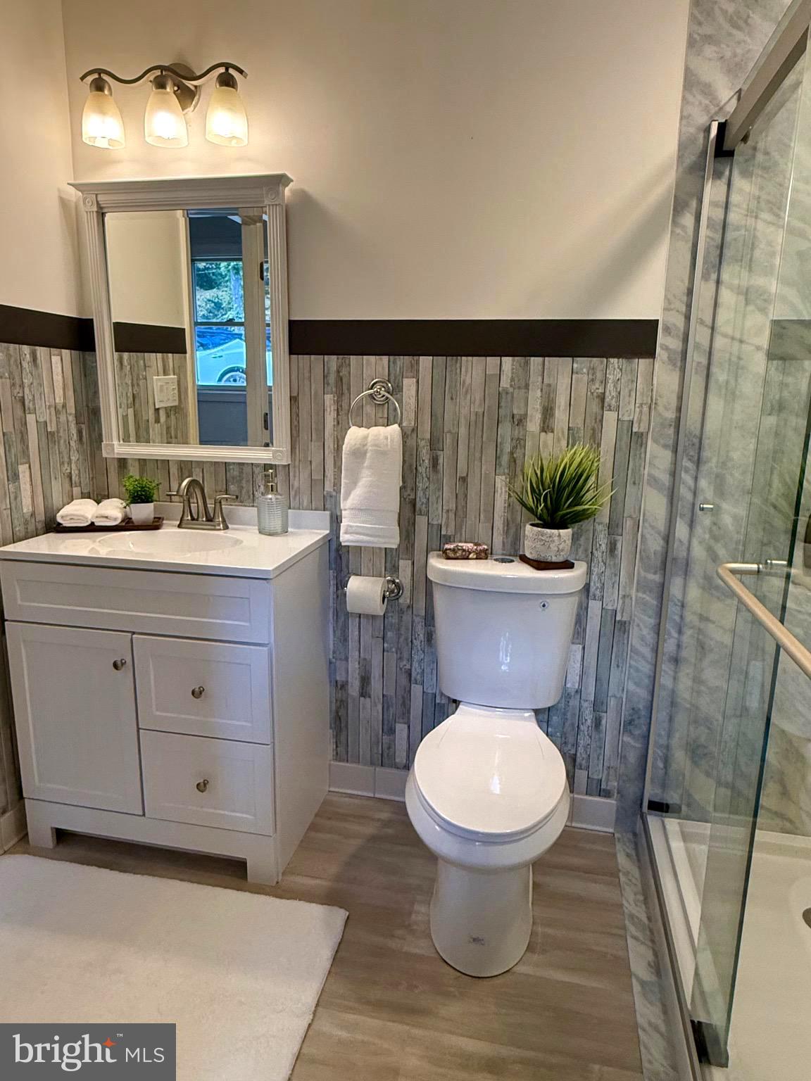 348 Trapper Ridge Lane Hedgesville, WV 25427 - Photo 16 of 41 a bathroom with a toilet sink and mirror