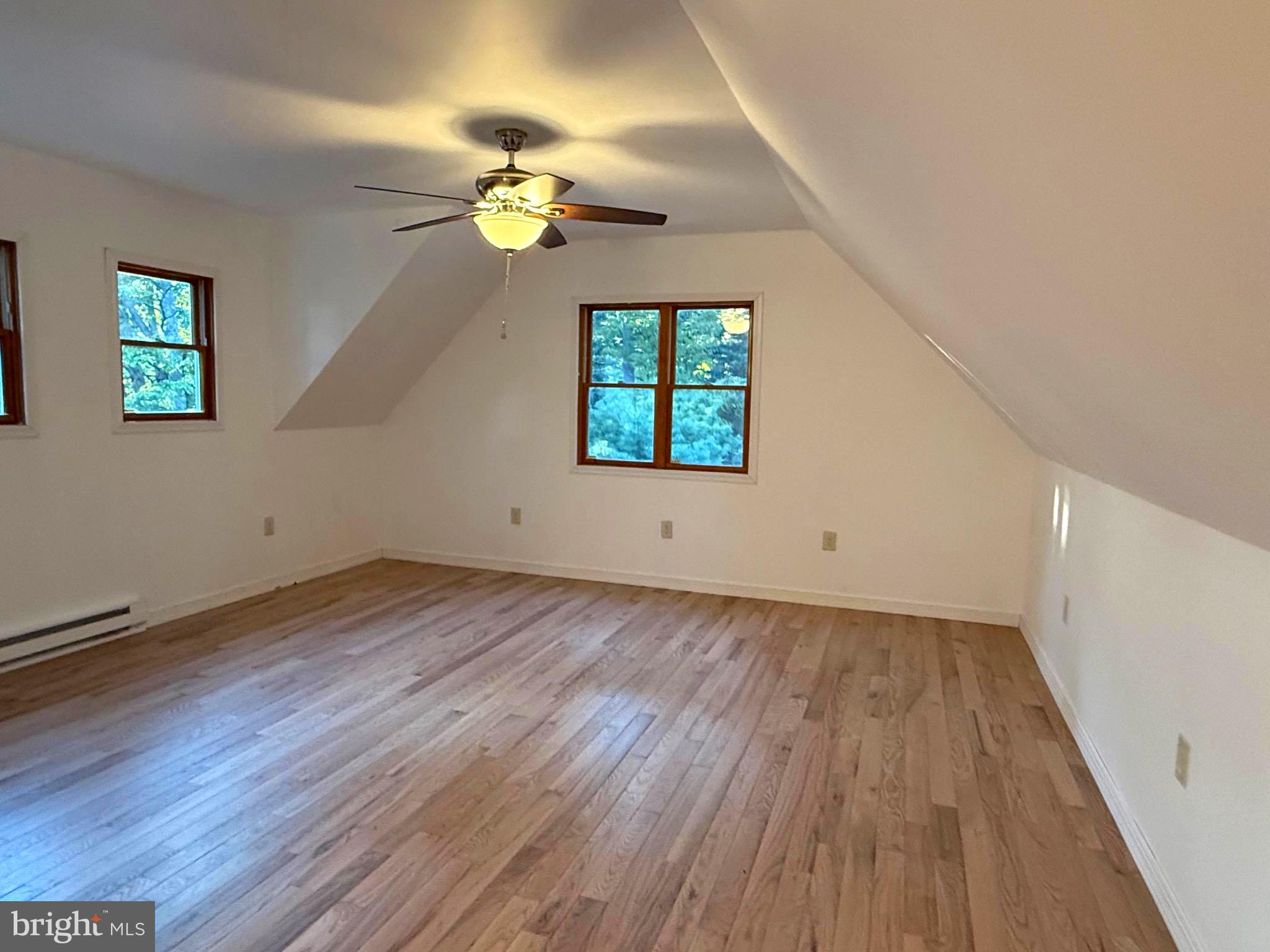 348 Trapper Ridge Lane Hedgesville, WV 25427 - Photo 21 of 41 a view of an empty room with wooden floor and a window