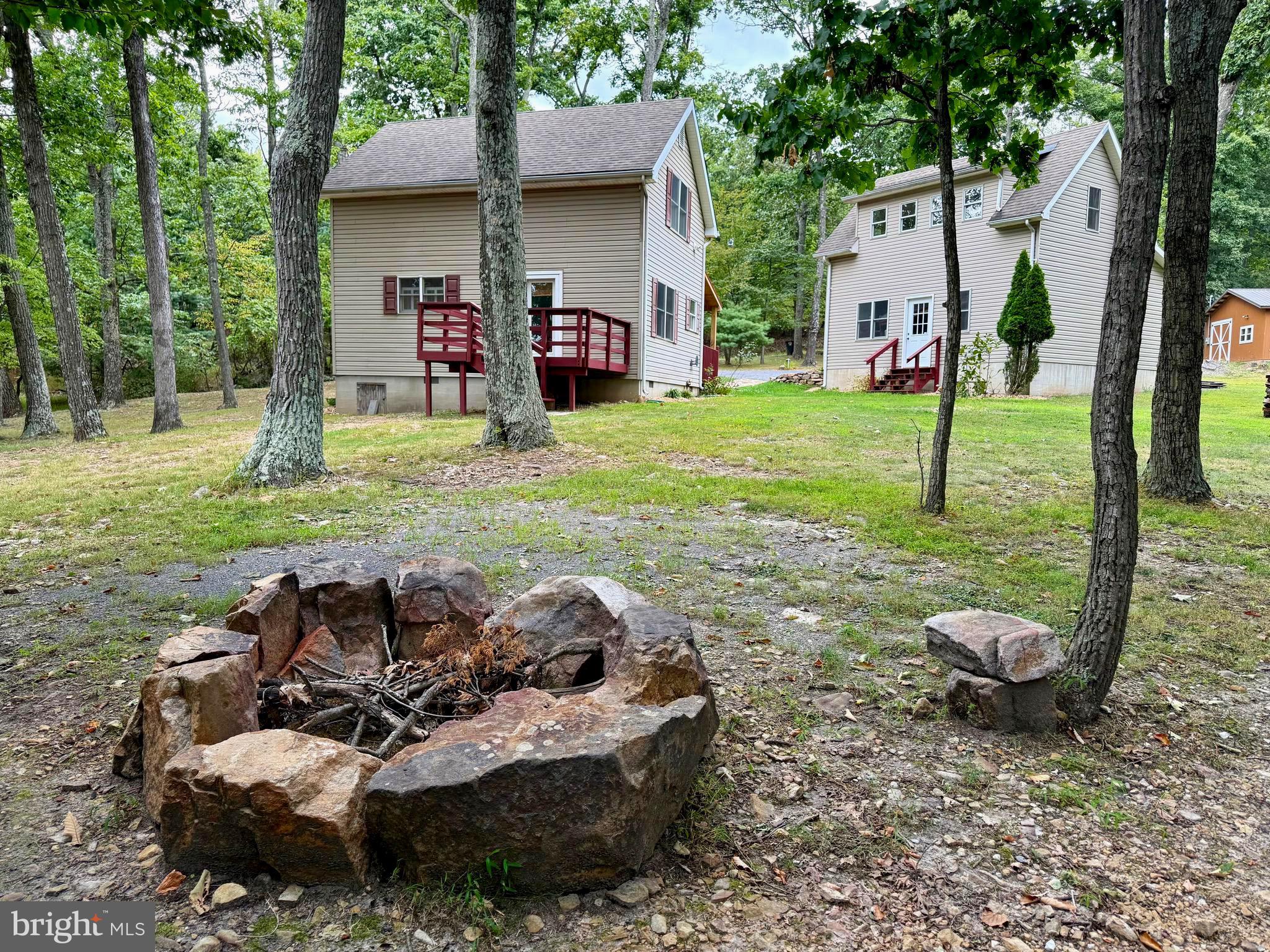 348 Trapper Ridge Lane Hedgesville, WV 25427 - Photo 25 of 41 a view of backyard of house with outdoor seating